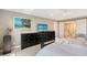 Another view of the main bedroom showing the ensuite bathroom and flat screen TV at 2425 Gulf Of Mexico Dr # 6A, Longboat Key, FL 34228