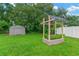A backyard with a shed and a raised garden bed in a shady area at 2522 51St Street E Ct, Palmetto, FL 34221