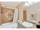 Well-lit bathroom features tile surround tub, shower, and vanity with ample counter space at 2522 51St Street E Ct, Palmetto, FL 34221