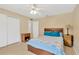 Bedroom featuring a ceiling fan, wood floors, and bright natural light at 2522 51St Street E Ct, Palmetto, FL 34221