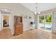 Dining room with hutch, tile floors, and sliding glass doors opening to a pool at 2522 51St Street E Ct, Palmetto, FL 34221