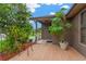 Inviting front porch area with brick pavers and lush greenery, creating a serene outdoor space at 2522 51St Street E Ct, Palmetto, FL 34221