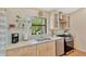 Bright kitchen with stainless steel appliances, granite countertops, and view of the backyard at 2522 51St Street E Ct, Palmetto, FL 34221