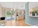 Bright kitchen with stainless steel appliances and a view of the pool through sliding glass doors at 2522 51St Street E Ct, Palmetto, FL 34221