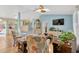 Open living space with a view of the kitchen, complete with a skylight and stylish decor at 2522 51St Street E Ct, Palmetto, FL 34221