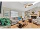 Comfortable living room with a fireplace, skylight and stylish furnishings at 2522 51St Street E Ct, Palmetto, FL 34221