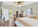 Spacious main bedroom featuring an ensuite bath, walk-in closet, and wood-look floors at 2522 51St Street E Ct, Palmetto, FL 34221
