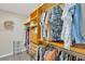 Walk-in closet with custom wood shelving, hanging rods, and built-in storage at 2522 51St Street E Ct, Palmetto, FL 34221