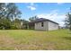 A lovely home featuring a spacious backyard and covered patio, ideal for outdoor living and entertaining at 2704 Gaspar Ave, North Port, FL 34288