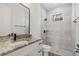 Bathroom featuring a shower and tub combination with stylish granite counters at 2704 Gaspar Ave, North Port, FL 34288