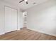 Bedroom with wood-look flooring and spacious closet at 2704 Gaspar Ave, North Port, FL 34288