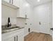 Laundry room with granite countertop and cabinets at 2704 Gaspar Ave, North Port, FL 34288