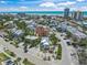 High angle shot overlooking the community with palm trees in the landscaping and the waterfront in the background at 302 And 304 Canal Rd, Sarasota, FL 34242