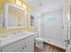 Bright bathroom with white subway tile shower, vanity, and wood-look tile flooring at 302 And 304 Canal Rd, Sarasota, FL 34242