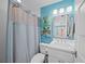 Bathroom with a shower, vanity, and coastal inspired decor at 302 And 304 Canal Rd, Sarasota, FL 34242