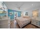 Bright bedroom featuring coastal decor, white furnishings, and a serene vacation vibe at 302 And 304 Canal Rd, Sarasota, FL 34242
