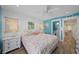 Comfortable bedroom with beach themed decor, fan, and plenty of natural light at 302 And 304 Canal Rd, Sarasota, FL 34242