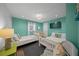 Bedroom with two beds, wood-look floors and overhead light at 302 And 304 Canal Rd, Sarasota, FL 34242