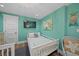 Cozy bedroom with a twin bed, TV, and nautical decor provides a relaxing vacation space at 302 And 304 Canal Rd, Sarasota, FL 34242