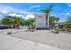 Modern two-story home with manicured landscaping and decorative rock features at 302 And 304 Canal Rd, Sarasota, FL 34242