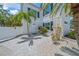 Charming ground-level entrance with manicured landscaping and decorative gravel pathway at 302 And 304 Canal Rd, Sarasota, FL 34242