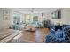 Inviting living room area with comfortable seating, entertainment center, and lots of natural light at 302 And 304 Canal Rd, Sarasota, FL 34242