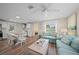 Spacious living area with dining area, kitchen, and comfortable seating in an open concept layout at 302 And 304 Canal Rd, Sarasota, FL 34242
