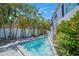 Relaxing backyard area featuring a pool, landscaping, and privacy fence at 302 And 304 Canal Rd, Sarasota, FL 34242