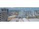 High-angle view shows the building's architectural design and vibrant community surroundings on a bright sunny day at 33 S Palm Ave # 1303, Sarasota, FL 34236
