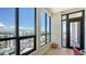 Balcony view with floor to ceiling windows and exterior door overlooking the city at 33 S Palm Ave # 1303, Sarasota, FL 34236