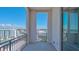 Balcony view with metal railings overlooking the city buildings and blue skies at 33 S Palm Ave # 1303, Sarasota, FL 34236
