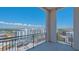 Balcony view with metal railings overlooking city buildings, green trees and blue skies at 33 S Palm Ave # 1303, Sarasota, FL 34236