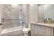Bright bathroom with modern fixtures and featuring a luxurious bathtub and shower with white marble tiling at 33 S Palm Ave # 1303, Sarasota, FL 34236