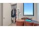 Bedroom with a functional writing desk and large closet with custom shelving for organized storage at 33 S Palm Ave # 1303, Sarasota, FL 34236