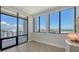 Bright bedroom with large windows offering panoramic views and access to a balcony at 33 S Palm Ave # 1303, Sarasota, FL 34236