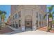 Elegant building entrance with classic architectural details and manicured landscaping at 33 S Palm Ave # 1303, Sarasota, FL 34236
