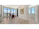 Dining area with hardwood floors, modern art, and expansive windows showcasing city views at 33 S Palm Ave # 1303, Sarasota, FL 34236
