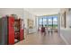 Bright dining area featuring hardwood floors, decorative art, and expansive windows offering city views at 33 S Palm Ave # 1303, Sarasota, FL 34236