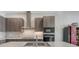 Stylish kitchen with sleek wood cabinetry, stainless steel appliances, and modern fixtures at 33 S Palm Ave # 1303, Sarasota, FL 34236