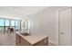 Bright, modern kitchen featuring a large island, sleek countertops, and beautiful hardwood floors with a view at 33 S Palm Ave # 1303, Sarasota, FL 34236