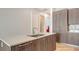 Gourmet kitchen with stainless steel appliances, wood cabinets, and large island offering ample counter space at 33 S Palm Ave # 1303, Sarasota, FL 34236