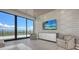 Sophisticated living room with cityscape views from floor-to-ceiling windows and stylish textured wallpaper at 33 S Palm Ave # 1303, Sarasota, FL 34236