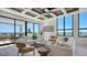 Bright living room with modern furniture, and access to an outdoor seating area at 33 S Palm Ave # 1303, Sarasota, FL 34236
