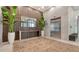 Luxurious lobby interior with decorative wood paneling, modern tile flooring, plants and elevator at 33 S Palm Ave # 1303, Sarasota, FL 34236