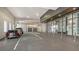 Outdoor parking garage with parked vehicles, building entrance and signage at 33 S Palm Ave # 1303, Sarasota, FL 34236