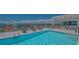 Rooftop pool and sun deck with lounge chairs and city view in this luxury condo at 33 S Palm Ave # 1303, Sarasota, FL 34236
