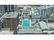 Inviting rooftop pool surrounded by lounge chairs with city views at 33 S Palm Ave # 1303, Sarasota, FL 34236