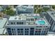 Stylish rooftop with pool, lounge seating, and a covered patio with a full outdoor living area at 33 S Palm Ave # 1303, Sarasota, FL 34236
