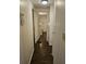Hallway with wood look flooring leading to bedroom and bathroom at 3318 Oakwood S Blvd, Sarasota, FL 34237