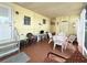 Comfortable screened porch with dining and seating area at 3318 Oakwood S Blvd, Sarasota, FL 34237